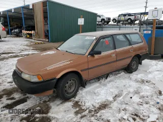 1989 Toyota Camry z VIN JT2SV21W5K0240987, wystawiony jako Copart lot #42248385 z przebiegiem 246 651 mil mil oraz Czysty tytuł • Clean title. Historia ofert i sprzedaży dostępna na DreamBid. Obrazek 1.