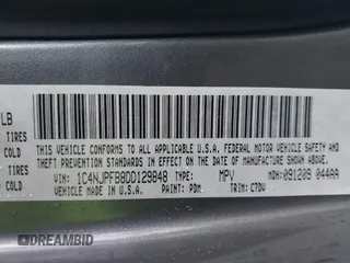 2013 Jeep Patriot Latitude with VIN 1C4NJPFB8DD129848, listed as a IAAI auction lot 40949386 with 168,839 mi miles and . Bid and sale history available at carsss.com. Image 9.