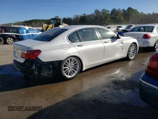 2013 BMW 7 Series 750i with VIN WBAYA8C55DC996693, listed as a Copart auction lot 80233423 with 140,925 mi miles and Salvage Title. Bid and sale history available at DreamBid. Image 3.