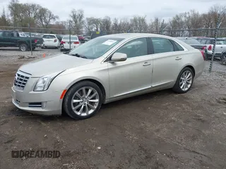 2013 Cadillac XTS Luxury z VIN 2G61R5S30D9174924, wystawiony jako IAAI lot #41958461 z przebiegiem 78 673 mil mil oraz . Historia ofert i sprzedaży dostępna na DreamBid. Obrazek 2.