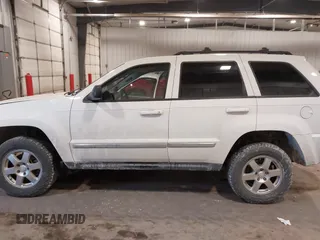 2010 Jeep Grand Cherokee Laredo with VIN 1J4PR4GK7AC126059, listed as a IAAI auction lot 41599058 with 154,192 mi miles. Bid and sale history available at carsss.com. Image 15.