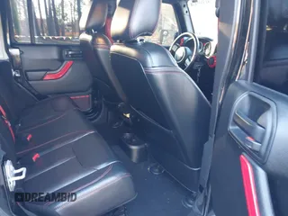 2017 Jeep Wrangler Unlimited Rubicon Recon z VIN 1C4BJWFG4HL723096, wystawiony jako IAAI lot #41393584 z przebiegiem 102 045 mil mil oraz . Historia ofert i sprzedaży dostępna na DreamBid. Obrazek 8.