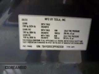 2023 Tesla Model Y Long Range z VIN 7SAYGDEE3PF862038, wystawiony jako Copart lot #57639325 z przebiegiem 11 020 mil mil oraz Szkoda całkowita • Salvage title. Historia ofert i sprzedaży dostępna na DreamBid. Obrazek 13.