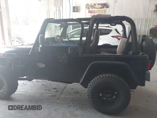 1999 Jeep Wrangler Sport with VIN 1J4FY19S4XP494405, listed as a IAAI auction lot 42542416 with 168,856 mi miles and . Bid and sale history available at DreamBid. Image 14.