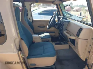 1999 Jeep Wrangler Sahara with VIN 1J4FY49S8XP462512, listed as a IAAI auction lot 42165052 with 146,135 mi miles and . Bid and sale history available at DreamBid. Image 5.