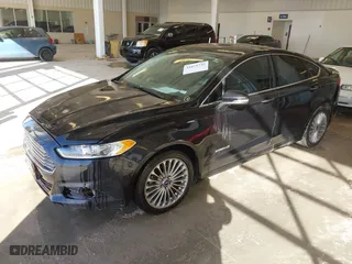 2014 Ford Fusion Titanium Hybrid with VIN 3FA6P0RU1ER290290, listed as a IAAI auction lot 41671735 with 207,405 mi miles. Bid and sale history available at carsss.com. Image 2.