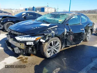 2020 Nissan Maxima SV with VIN 1N4AA6CV2LC363890, listed as a IAAI auction lot 41429411 with 77,718 mi miles and . Bid and sale history available at DreamBid. Image 2.