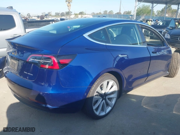 2019 Tesla Model 3 Long Range with VIN 5YJ3E1EB3KF497841, listed as a IAAI auction lot 41969728 with 21,127 mi miles. Bid and sale history available at carsss.com. Image 4.