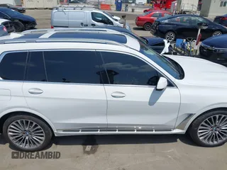 2019 BMW X7 xDrive50i z VIN 5UXCX4C54KLS38649, wystawiony jako IAAI lot #42435379 z przebiegiem 60 905 mil mil oraz . Historia ofert i sprzedaży dostępna na DreamBid. Obrazek 13.