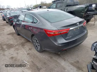 2018 Toyota Avalon XLE with VIN 4T1BK1EB9JU275097, listed as a IAAI auction lot 41940585 with 119,854 mi miles and . Bid and sale history available at DreamBid. Image 3.