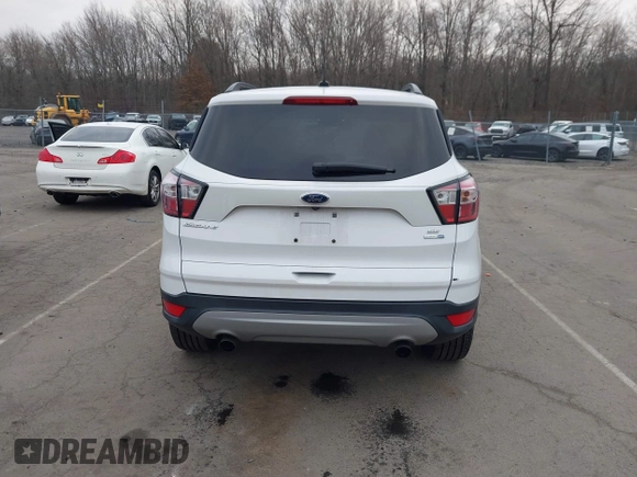 2018 Ford Escape SE z VIN 1FMCU9GD2JUC77186, wystawiony jako IAAI lot #41308133 z przebiegiem 123 156 mil mil oraz . Historia ofert i sprzedaży dostępna na DreamBid. Obrazek 16.