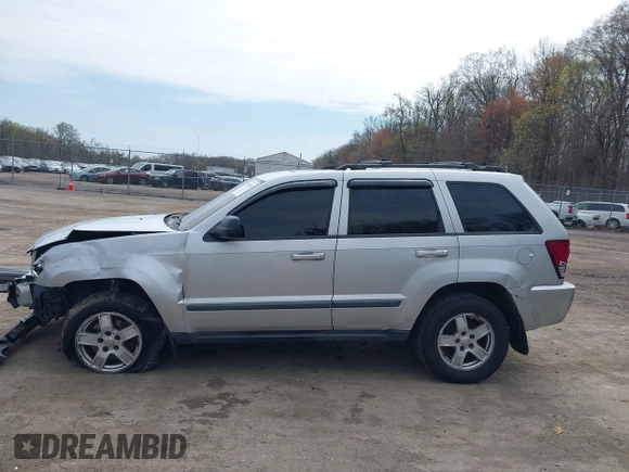 2007 Jeep Grand Cherokee Laredo with VIN 1J8HR48P77C570936, listed as a IAAI auction lot 41945531 with 200,821 mi miles. Bid and sale history available at carsss.com. Image 14.