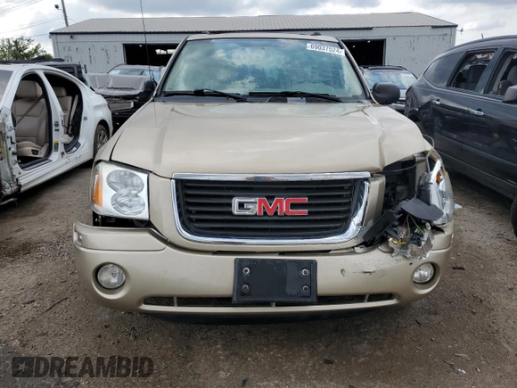 2004 GMC Envoy SLT with VIN 1GKDT13S142425057, listed as a Copart auction lot 69037524 with 231,483 mi miles and Salvage Title. Bid and sale history available at carsss.com. Image 5.