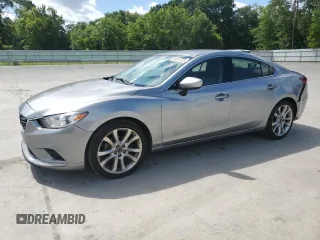 2014 Mazda 6 i Touring with VIN JM1GJ1V64E1148054, listed as a Copart auction lot 60818735 with 225,636 mi miles and Salvage title. Bid and sale history available at DreamBid. Image 1.