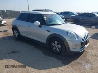 2016 MINI Hardtop 4 Door with VIN WMWXU1C52G2D10472, listed as a IAAI auction lot 42048217 with 90,474 mi miles and . Bid and sale history available at DreamBid. Image 1.