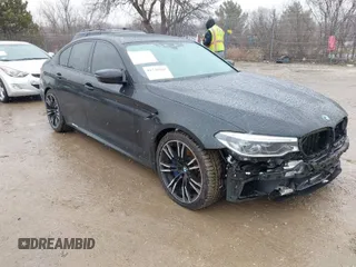 2020 BMW M5 Competition z VIN WBSJF0C00LCD37331, wystawiony jako IAAI lot #41738410 z przebiegiem 49 788 mil mil oraz . Historia ofert i sprzedaży dostępna na DreamBid. Obrazek 1.