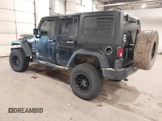 2017 Jeep Wrangler Unlimited Sport with VIN 1C4BJWDGXHL698014, listed as a IAAI auction lot 41384325 with 121,402 mi miles. Bid and sale history available at carsss.com. Image 3.
