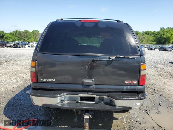 2005 GMC Yukon SLT z VIN 1GKEC13TX5R106956, wystawiony jako Copart lot #52486205 z przebiegiem 317 375 mil mil oraz Szkoda całkowita • Salvage title. Historia ofert i sprzedaży dostępna na DreamBid. Obrazek 6.