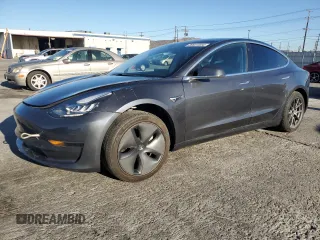 2020 Tesla Model 3 Standard Range Plus with VIN 5YJ3E1EA7LF803660, listed as a Copart auction lot 86631504 with 61,062 mi miles and Salvage Title. Bid and sale history available at DreamBid. Image 1.