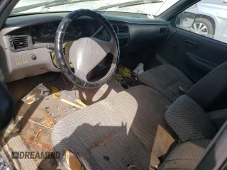 1995 Toyota T100 DX z VIN JT4VD12E4S0008162, wystawiony jako Copart lot #65768104 z przebiegiem 404 762 mil mil oraz Nie do naprawy. Historia ofert i sprzedaży dostępna na DreamBid. Obrazek 8.