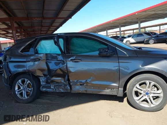 2015 Ford Edge Titanium z VIN 2FMTK3K90FBC12582, wystawiony jako IAAI lot #41860973 z przebiegiem Nie podano mil oraz . Historia ofert i sprzedaży dostępna na DreamBid. Obrazek 12.