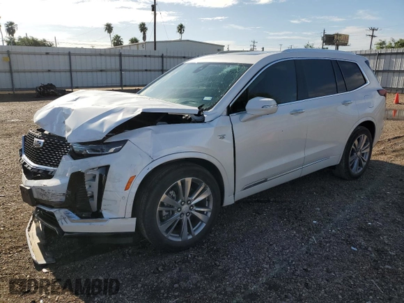 2023 Cadillac XT6 FWD Premium Luxury with VIN 1GYKPCRS5PZ120905, listed as a Copart auction lot 64374254 with 30,694 mi miles and Salvage title. Bid and sale history available at DreamBid. Image 1.