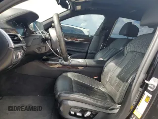 2019 BMW 7 Series M760i xDrive with VIN WBA7H6C58KG615081, listed as a Copart auction lot 59361704 with 92,769 mi miles and Salvage Title. Bid and sale history available at carsss.com. Image 7.