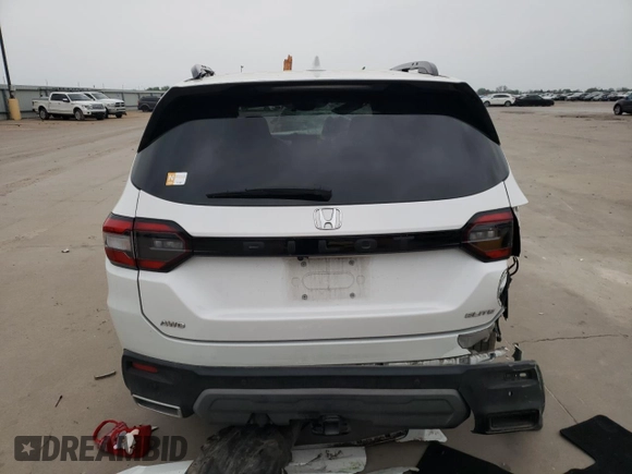 2023 Honda Pilot Elite z VIN 5FNYG1H81PB045653, wystawiony jako Copart lot #51252065 z przebiegiem 57 388 mil mil oraz Szkoda całkowita • Salvage title. Historia ofert i sprzedaży dostępna na DreamBid. Obrazek 6.