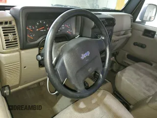2005 Jeep Wrangler Sport z VIN 1J4FA49S75P325028, wystawiony jako Copart lot #56942315 z przebiegiem 169 988 mil mil oraz Szkoda całkowita • Salvage title. Historia ofert i sprzedaży dostępna na DreamBid. Obrazek 8.