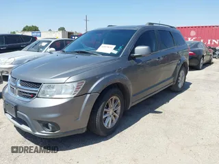 2013 Dodge Journey SXT with VIN 3C4PDCBB4DT563709, listed as a IAAI auction lot 42019033 with 201,188 mi miles. Bid and sale history available at carsss.com. Image 2.