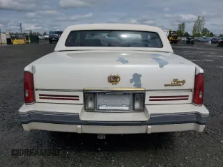 1991 Cadillac Eldorado z VIN 1G6EL13B9MU604115, wystawiony jako Copart lot #52232425 z przebiegiem 95 570 mil mil oraz Szkody całkowita. Historia ofert i sprzedaży dostępna na DreamBid. Obrazek 6.