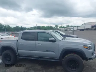 2021 Toyota Tacoma SR with VIN 5TFCZ5AN3MX258746, listed as a IAAI auction lot 42252967 with 62,095 mi miles and . Bid and sale history available at DreamBid. Image 13.