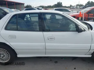 1997 Pontiac Grand Am SE with VIN 1G2NE52T3VC809661, listed as a IAAI auction lot 41100711 with 168,686 mi miles. Bid and sale history available at carsss.com. Image 13.