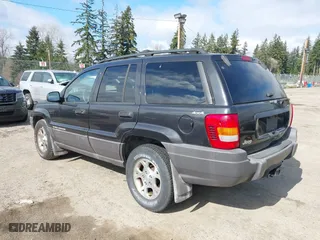 1999 Jeep Grand Cherokee Laredo with VIN 1J4GW58S6XC524451, listed as a IAAI auction lot 41741007 with 162,441 mi miles. Bid and sale history available at carsss.com. Image 3.