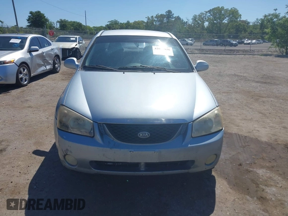 2005 Kia Spectra LX with VIN KNAFE121955107403, listed as a IAAI auction lot 42055036 with 157,605 mi miles. Bid and sale history available at carsss.com. Image 12.