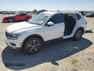 2019 Volkswagen Tiguan SE with VIN 3VV2B7AX5KM009947, listed as a Copart auction lot 54951455 with 90,569 mi miles and Salvage Title. Bid and sale history available at DreamBid. Image 1.