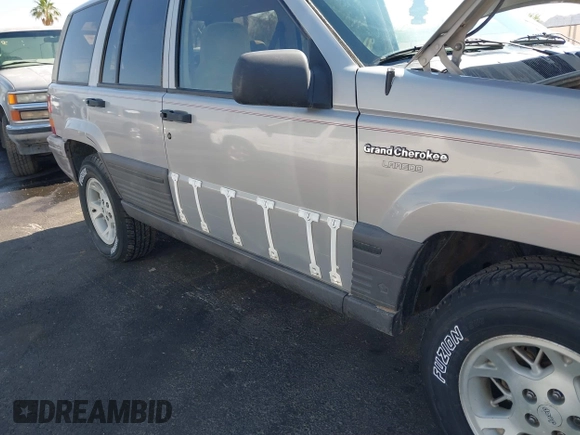 1994 Jeep Grand Cherokee Laredo with VIN 1J4GZ58S4RC325909, listed as a IAAI auction lot 39580601 with 162,952 mi miles. Bid and sale history available at carsss.com. Image 12.