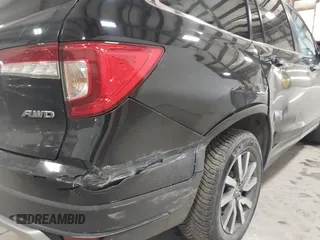 2019 Honda Pilot EX-L with VIN 5FNYF6H5XKB067858, listed as a IAAI auction lot 41643807 with 102,114 mi miles and . Bid and sale history available at carsss.com. Image 14.