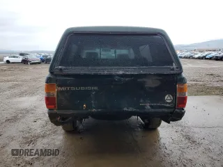 1995 Mitsubishi Mighty Max z VIN JA7LS21G4SP000718, wystawiony jako Copart lot #83634734 z przebiegiem 129 382 mil mil oraz Szkody całkowita. Historia ofert i sprzedaży dostępna na DreamBid. Obrazek 6.