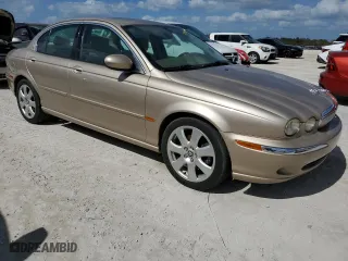 2004 Jaguar X-Type with VIN SAJEA51C34WE03194, listed as a Copart auction lot 78980144 with 51,164 mi miles and Clean Title. Bid and sale history available at carsss.com. Image 4.