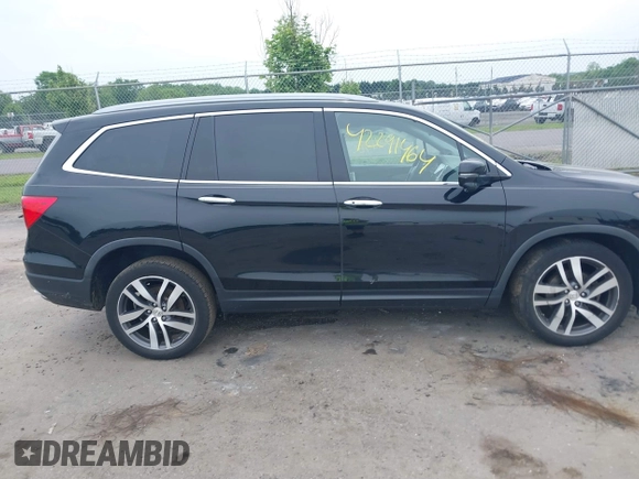 2017 Honda Pilot Touring with VIN 5FNYF6H90HB052474, listed as a IAAI auction lot 42291464 with 103,288 mi miles and . Bid and sale history available at DreamBid. Image 13.