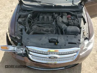 2012 Ford Taurus Limited z VIN 1FAHP2FW4CG112923, wystawiony jako Copart lot #56169085 z przebiegiem 142 687 mil mil oraz Szkoda całkowita • Salvage title. Historia ofert i sprzedaży dostępna na DreamBid. Obrazek 11.