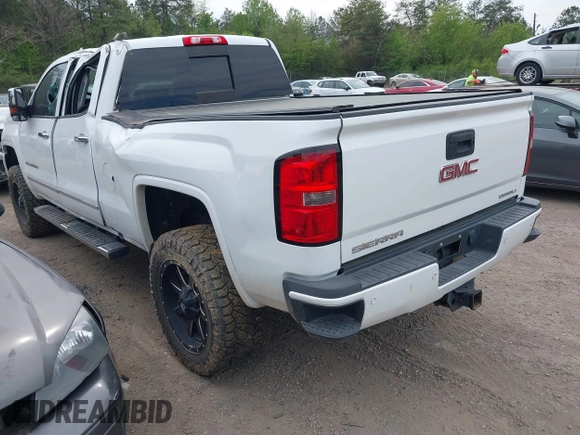 2016 GMC Sierra 2500HD Denali z VIN 1GT12UE82GF130096, wystawiony jako IAAI lot #41869448 z przebiegiem 129 659 mil mil oraz . Historia ofert i sprzedaży dostępna na DreamBid. Obrazek 3.