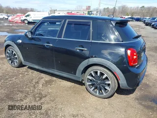 2017 MINI Hardtop 4 Door Cooper S z VIN WMWXU3C39H2F48699, wystawiony jako IAAI lot #41924423 z przebiegiem 81 249 mil mil oraz . Historia ofert i sprzedaży dostępna na DreamBid. Obrazek 3.