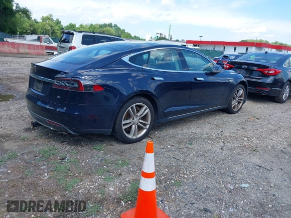 2013 Tesla Model S with VIN 5YJSA1CN0DFP21851, listed as a IAAI auction lot 42557791 with 106,328 mi miles and . Bid and sale history available at DreamBid. Image 4.