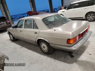 1990 Mercedes-Benz 560 with VIN WDBCA39E7LA517710, listed as a Copart auction lot 85307074 with 225,233 mi miles and Salvage Title. Bid and sale history available at DreamBid. Image 2.