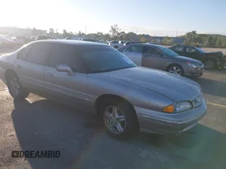 1997 Pontiac Bonneville SE z VIN 1G2HX52KXVH267881, wystawiony jako IAAI lot #41682513 z przebiegiem 115 609 mil mil oraz . Historia ofert i sprzedaży dostępna na DreamBid. Obrazek 1.