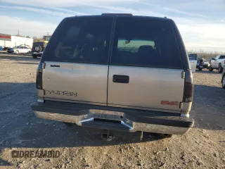 1999 GMC Yukon with VIN 1GKEK13R3XJ785249, listed as a Copart auction lot 42825185 with 351,225 mi miles and Salvage Title. Bid and sale history available at carsss.com. Image 6.