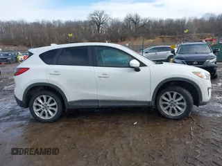2014 Mazda CX-5 Grand Touring with VIN JM3KE4DY9E0300491, listed as a IAAI auction lot 41657153 with 157,394 mi miles and . Bid and sale history available at DreamBid. Image 13.
