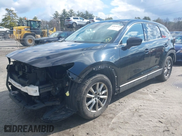 2019 Mazda CX-9 Touring z VIN JM3TCBCY0K0317028, wystawiony jako IAAI lot #41814713 z przebiegiem 155 280 mil mil oraz . Historia ofert i sprzedaży dostępna na DreamBid. Obrazek 2.